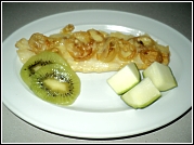 Entree a la Ohau fried fish topped with onion rings and melted cheese